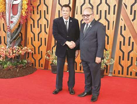 President Rodrigo Duterte is greeted by Papua New Guineau2019s Prime Minister Peter Ou2019Neill at the Apec Summit, Port Moresby, Papua New Guinea, yesterday.