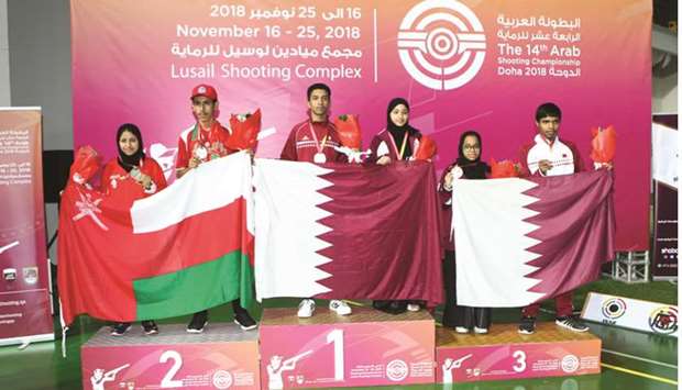 (From left) second-placed Oman 1, first-placed Qatar 1 and third-placed Qatar 2 pose with their air rifle mixed team junior medals yesterday.