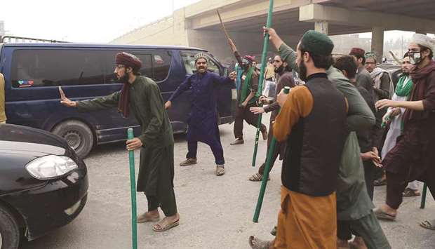 This picture taken on Thursday shows TLP supporters stopping traffic during their protest in Peshawar.