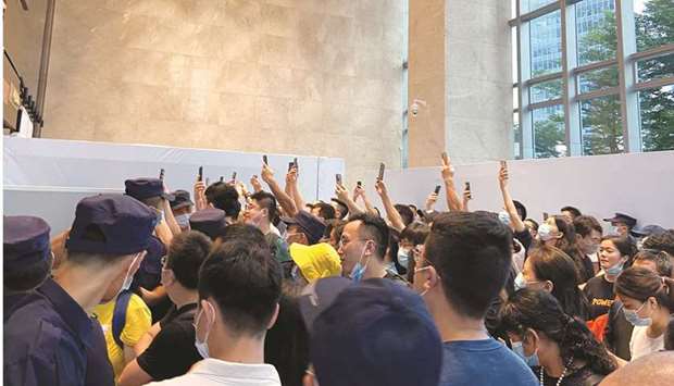 People gather to demand repayment of loans and financial products at the Evergrandeu2019s headquarters, in Shenzhen, Guangdong province on September 13. The difficulties of the real estate sector in China triggered by the troubles of giant Evergrande could pose risks for the world economy and affect the United States, the Federal Reserve warned in its report on financial stability released Monday.