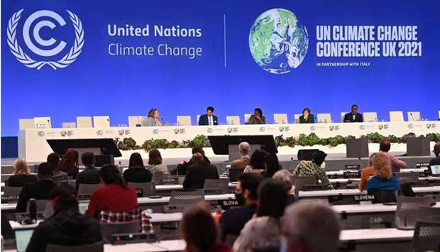 Delegates attend the the Improving the Scale and Effectiveness of Adaptation Finance session at the COP26 UN Climate Change Conference in Glasgow on November 8, 2021. AFP