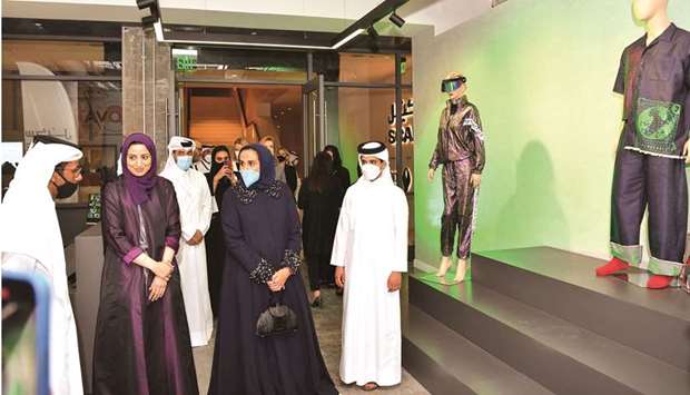 HE Sheikha Al Mayassa bint Hamad bin Khalifa al-Thani, chairperson of Qatar Museums, listens to a briefing on Scale7 during the opening tour.