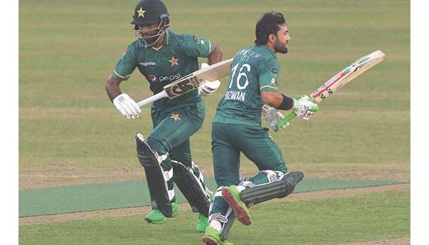 Pakistanu2019s Mohamed Rizwan (right) and Fakhar Zaman in action during the second T20I against Bangladesh at the Sher-e-Bangla National Cricket Stadium in Dhaka yesterday. (AFP)