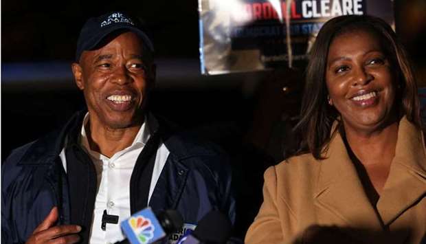 Democratic NYC Mayoral candidate Eric Adams and state Attorney General and gubernatorial candidate Letitia James smile as they listen to speakers during a Get Out the Vote rally at A. Philip Randolph Square in Harlem yesterday in New York City