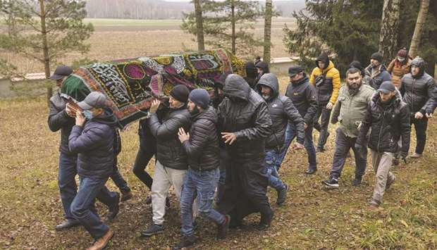 Polish Muslim community members attend the funeral of a Yemeni migrant  Mustafa Mohamed Murshed al-Raimi, a victim of a migrant crisis on the countryu2019s border with Belarus, in a village near Sokolka, Poland, yesterday. (Reuters)