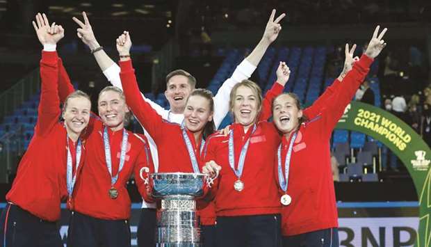 Russian team celebrates with trophy after winning the Billie Jean King Cup final in Prague. (Reuters)