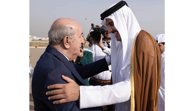 The President of the People's Democratic Republic of Algeria Abdelmadjid Tebboune welcomes His Highness the Amir Sheikh Tamim bin Hamad Al-Thani upon arrival at Houari Boumediene Airport, Algiers.