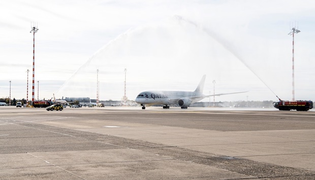 Operated by a Boeing 787 aircraft, flight QR085 was welcomed with a water canon salute upon arrival.