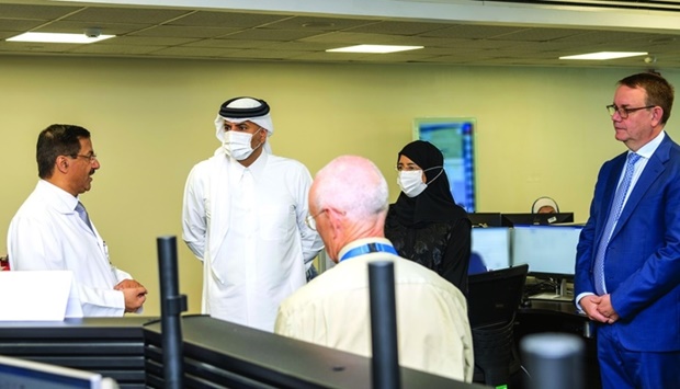 HE the Prime Minister and Minister of Interior Sheikh Khalid bin Khalifa bin Abdulaziz al-Thani and other dignitaries during their visit to the National Health Incident Command Centre.