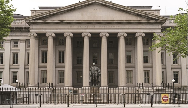 The US Treasury building in Washington, DC. The US Treasury halted the longest string of cutbacks to its quarterly sales of longer-term debt in about eight years, showcasing the end of a period of historic reduction in the fiscal deficit.