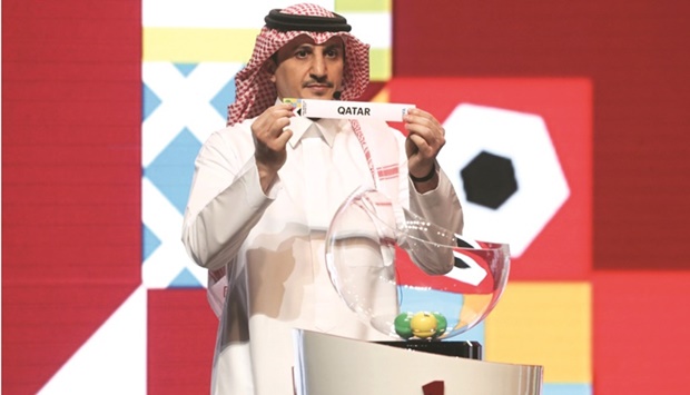 Saudi Arabiau2019s legend Nawaf al-Temyat picks Qatar during the draw ceremony for the FIFA World Cup in April.