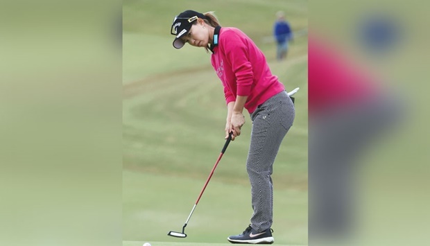 Momoko Ueda of Japan putts during the third round of the LPGA Japan Classic golf tournament in Otsu, Shiga prefecture, yesterday. (AFP)