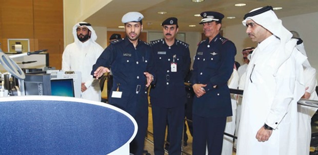 Director General of Public Security Staff Major General Saad bin Jassim al-Khulaifi, Kahramaa president engineer Essa Hilal al-Kuwari and other officials listening to a briefing at the launch of the linking.