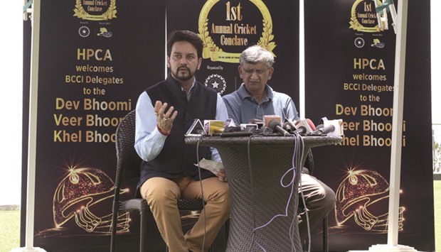 In this photograph taken on June 24, 2016, President of the Board of Control for Cricket in India (BCCI) Anurag Thakur (L) addresses a press conference in Dharamsala along with secretary Ajay Shirke.