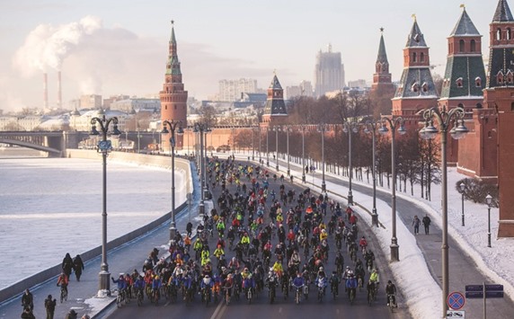 Participants of the cycling event ride past the Kremlin in Moscow.