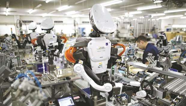 A humanoid robot working in a factory.