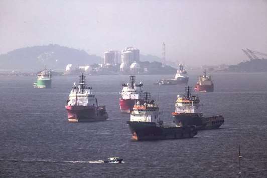 Supply vessels float in Guanabara Bay in front of a gas storage facility across from Petrobrasu2019 Comperj oil refinery in Rio de Janeiro (file). Though the country has just started to come out of a brutal recession, and is still reeling from a massive corruption probe, Brazil has its lures for investors with a longer view.