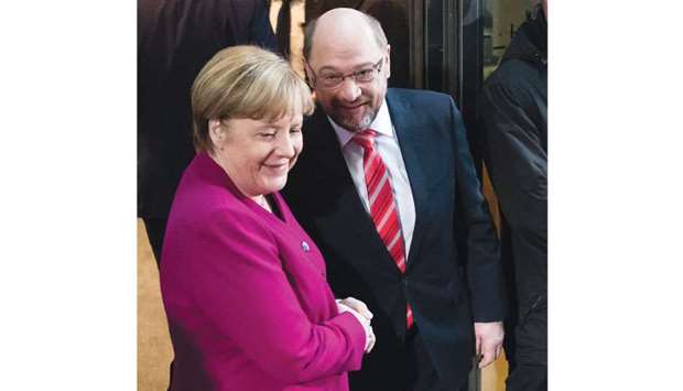 Merkel with Schulz on their arrival for a meeting in Berlin yesterday.