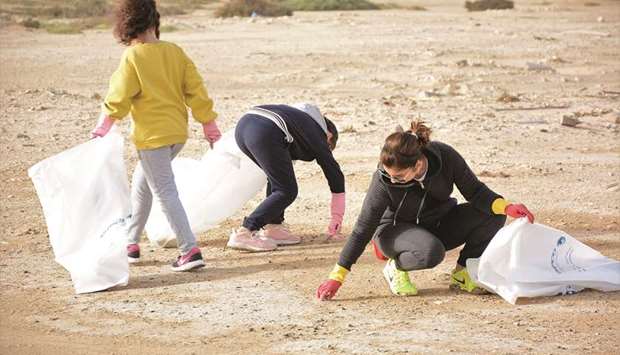 VOLUNTEERS: Kids and volunteers during the clean-up drive of a small mangrove and beach area close to Al Khor.