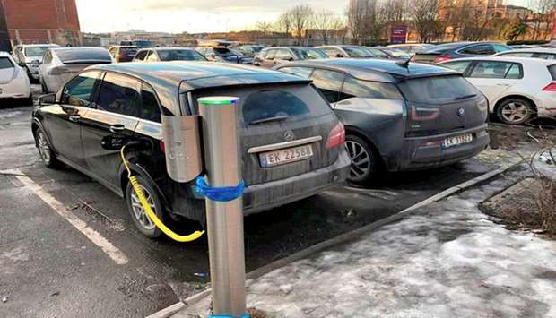 Electric cars are parked in Oslo, Norway