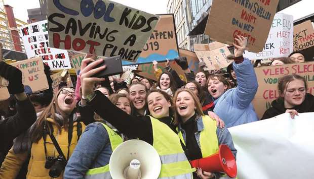 Protesting students take a u2018wefieu2019 during a demonstration on climate change in central Brussels.
