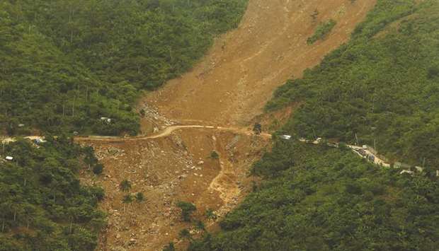 This aerial photo shows damage from landslides due to heavy rain caused by tropical storm Usman in Camarines Sur province.