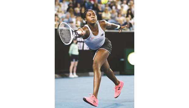 Coco Gauff of the US hits a return against Venus Williams of the US after their singles match on day one of the Australian Open in Melbourne yesterday. (Reuters)