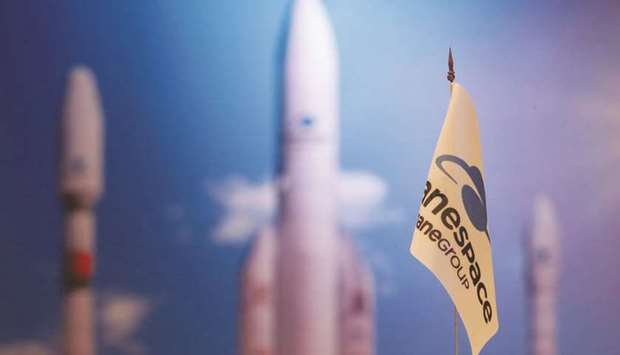 FILE PHOTO: A flag with a company logo is seen during satellite launch company Arianespace annual news conference in Paris, France, January 9, 2018.