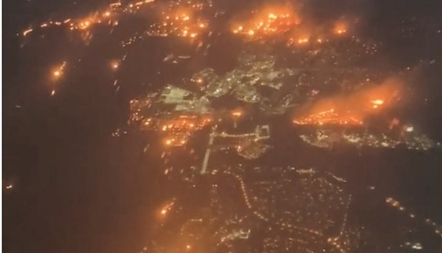 Fires burning in Superior are seen from a plane flying from Denver in this screen grab obtained from a social media video.