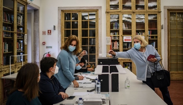 A woman casts her ballot at Galveias Palace polling station in Lisbon. AFP