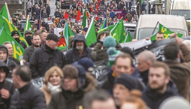 People take part in a remembrance march to commemorate the victims of the 1972 Bloody Sunday killings, from the Creggan area, to the Bogside area of Londonderry (Derry), Northern Ireland.