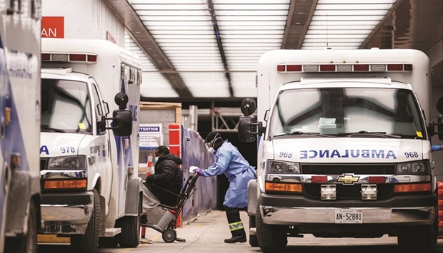 An ambulance crew delivers a patient at Mount Sinai Hospital as officials warned of a u201ctsunamiu201d of new coronavirus disease (Covid-19) cases in the days and weeks ahead due to the Omicron variant in Toronto, Ontario, Canada on Monday. A string of new studies has confirmed the silver lining of the Omicron variant: Even as case numbers soar to records, the numbers of severe cases and hospitalisations have not. The data, some scientists say, signal a new, less worrying chapter of the pandemic.