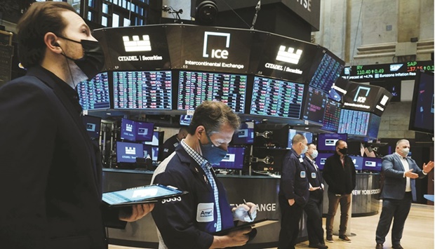 Traders work on the floor of the New York Stock Exchange. Investors are recalibrating their portfolios to account for a more hawkish Federal Reserve, as signs that the central bank is ready to pull out the stops in its fight against inflation has shaken up markets in the first week of 2022.