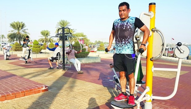 After his 8km jogging, Indian expatriate Somorendro finds time to exercise using most of the fitness equipment. PICTURE: Joey Aguilar