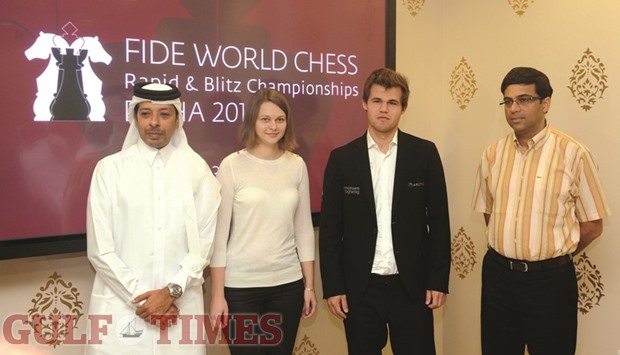 Qatar Chess Association general secretary Mohamed al-Medhaiki (left) poses with womenu2019s Blitz champion Anna Muzychuk (second from left), world champion Magnus Carlsen and former world champion Viswanathan Anand (right) at a press conference yesterday. PICTURES: Shemeer Rasheed