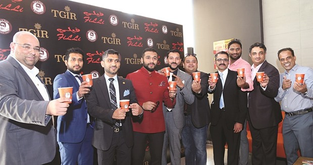 Rafih Filli (fourth left) and other officials at the opening of the FiLLi Cafe store at Salwa Road yesterday.