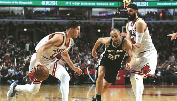 Chicago Bulls forward Doug McDermott (left) tries to get past San Antonio Spurs guard Manu Ginobili. (Mike DiNovo-USA TODAY Sports)