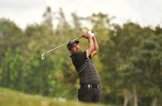 Shiv Kapur playing a shot during round three of the Royal Cup golf tournament in Pattaya. (AFP)