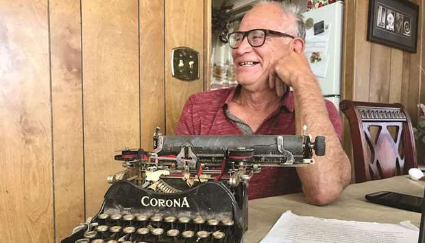 A CLASS APART: Jerry Valencia shows off an old Corona typewriter at his home.