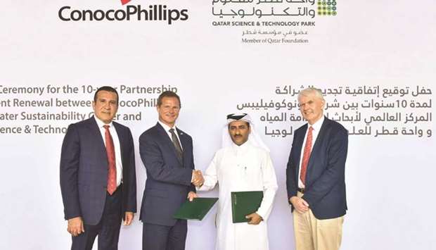 QSTP executive director, Yosouf Abdulrahman Saleh, shakes hands with president, Qatar Business Unit for ConocoPhillips, Todd Creeger, after signing the agreement in Doha yesterday.