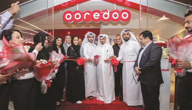 Ooredoo officials inaugurating the new shop at Msheireb Metro Station.