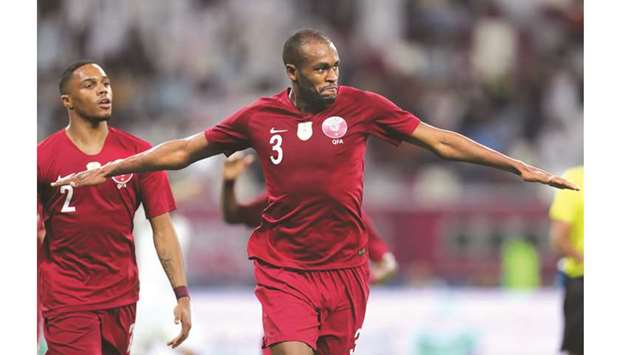 Qataru2019s Akram Afif (left) talks to UAEu2019s Ali Mabkhout during the 24th Arabian Gulf Cup Group A match at Khalifa International Stadium in Doha on Monday. Mabkhout is the top goalscorer of the tournament with five goals, while Afif is joint second with teammate Abdulkarim Hassan (right) with three goals each. (AFP)