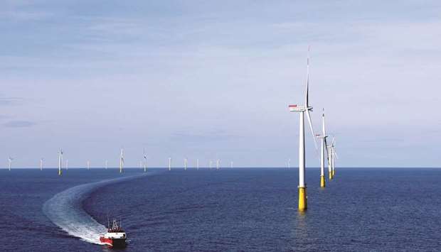 A boat sails past the DanTysk wind farm, 90km west of Esbjerg, Denmark (file). Socially responsible bonds are one of the few areas of optimism amid generally downbeat outlooks for 2021 European credit sales.