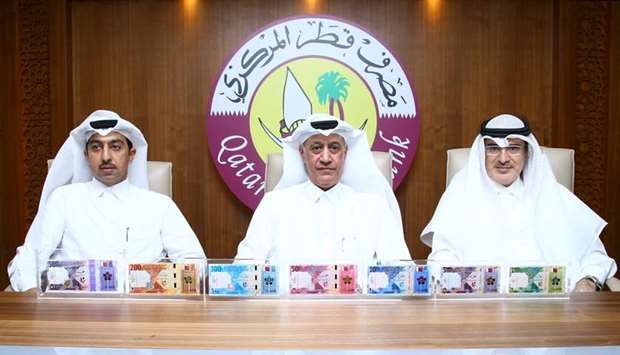 Qatar Central Bank (QCB) officials unveil new series of Qatari Riyal banknotes.  