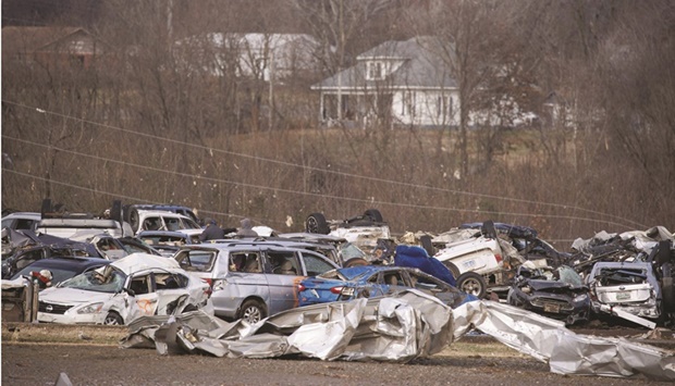 A view of broken cars piled up at the flattened Mayfield Consumer Products building yesterday in Mayfield, Kentucky. (AFP)