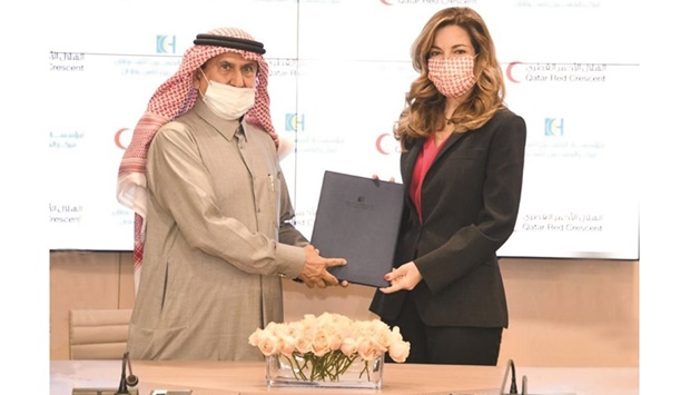 Ali bin Hassan al-Hammadi with Princess Ghida Talal at the signing ceremony.