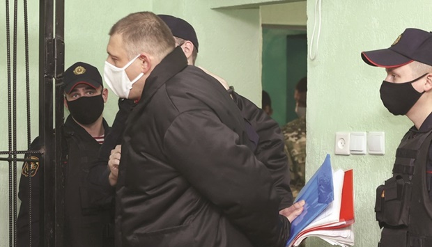 Sergei Tikhanovsky being escorted before the verdict in his trial in Gomel yesterday. (AFP)