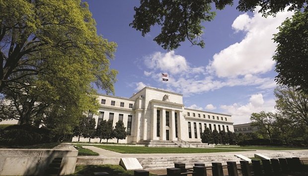 The Federal Reserve building in Washington. The move to a faster reduction in new bond purchases from $120bn a month to zero had been well telegraphed, as had the new forecasts from policymakers that have now convinced the market that the first interest rate increase will arrive no later than May, with more to follow by year-end.