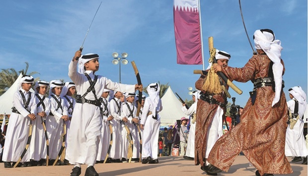 In this file photo Qatari boys are seen performing traditional dances during Qatar Museum of Islamic Art Community Day Event at Museum of Islamic Art Park in Doha. -  Supplied picture