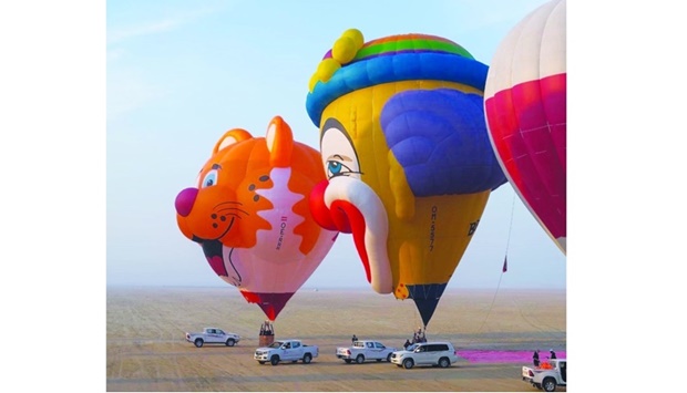 The hot-air balloons, from various countries around the world, take off from one location to another, giving people in the area a chance to see the balloons closer and vividly as they soar. -screengrab from Qatar Balloon Festival's Facenook page